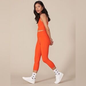 Girlfriend Collective High Rise Compressive Crop Leggings in Daybreak Orange